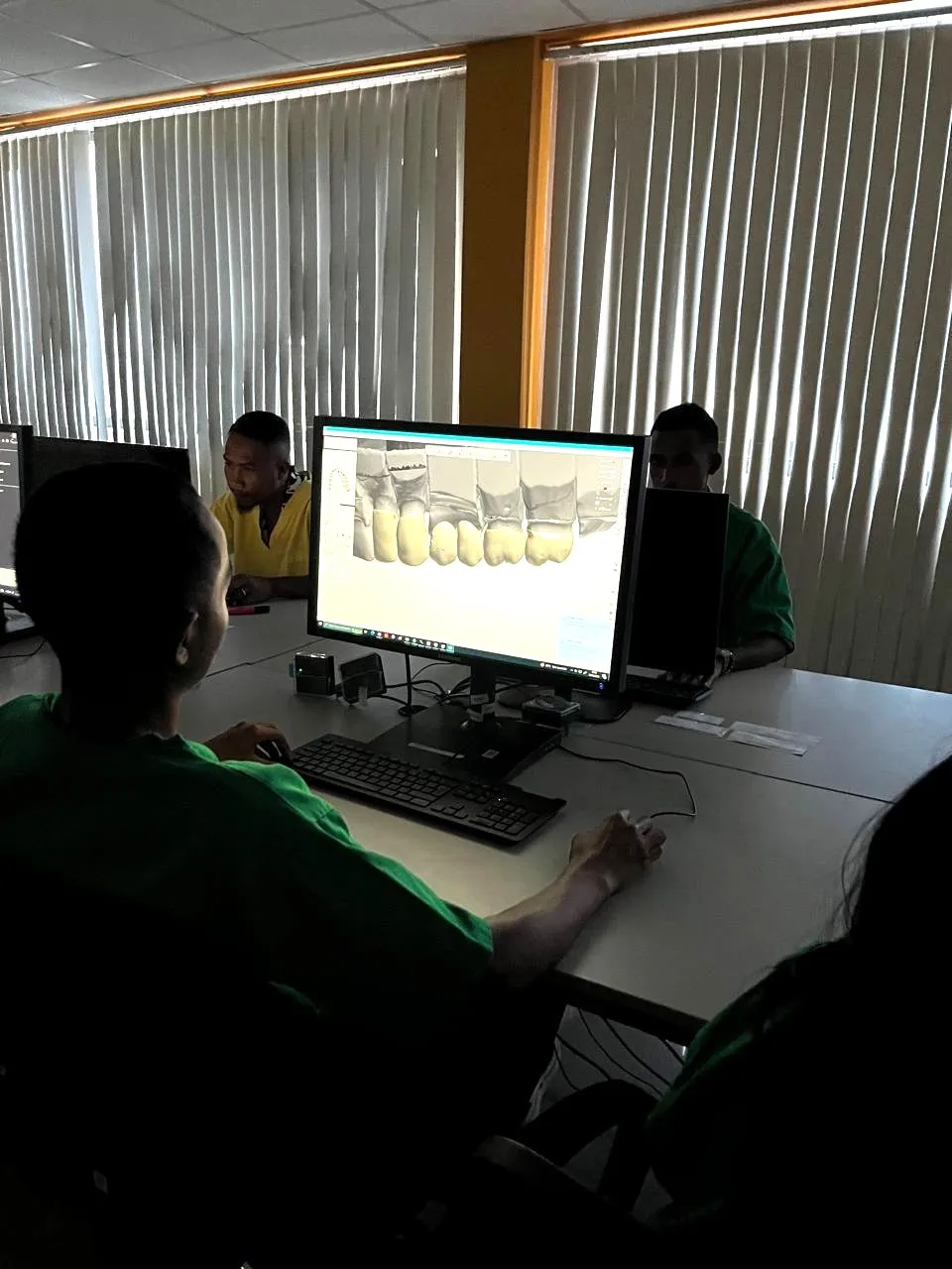 Technician designing a bridge in CAD software